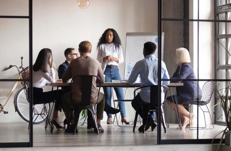 A group of people working in a conference room