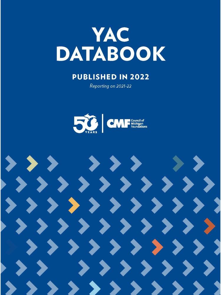 Cover of the YAC Databook with Blue background and the 50th CMF anniversary logo
