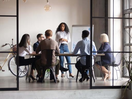 A group of people working in a conference room