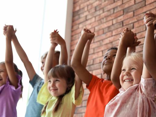 A group of children holding hands