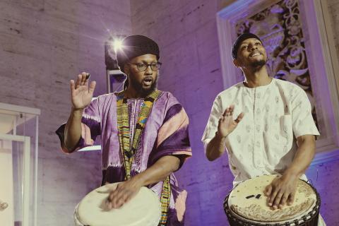 Chi Amen-Ra and Marwan Amen-Ra, the Amen-Ra drummers, perform traditional West African djembe music during the Kresge at 100 celebration at the Detroit Institute of Arts on June 11, 2024.