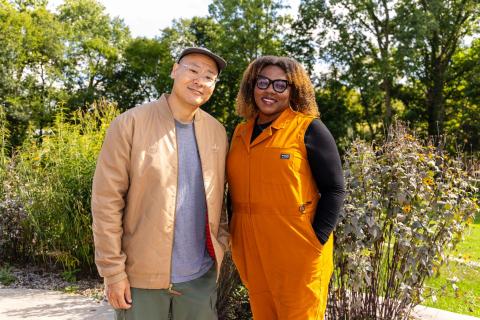 Dug Song and Khalilah Burt Gaston smile for a picture together outside on a sunny day.