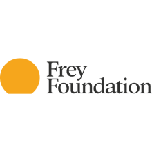 Frey Foundation logo with Frey on top of Foundation and right aligned with a circle that appears to be rising from the horizon and is a gold color and left aligned