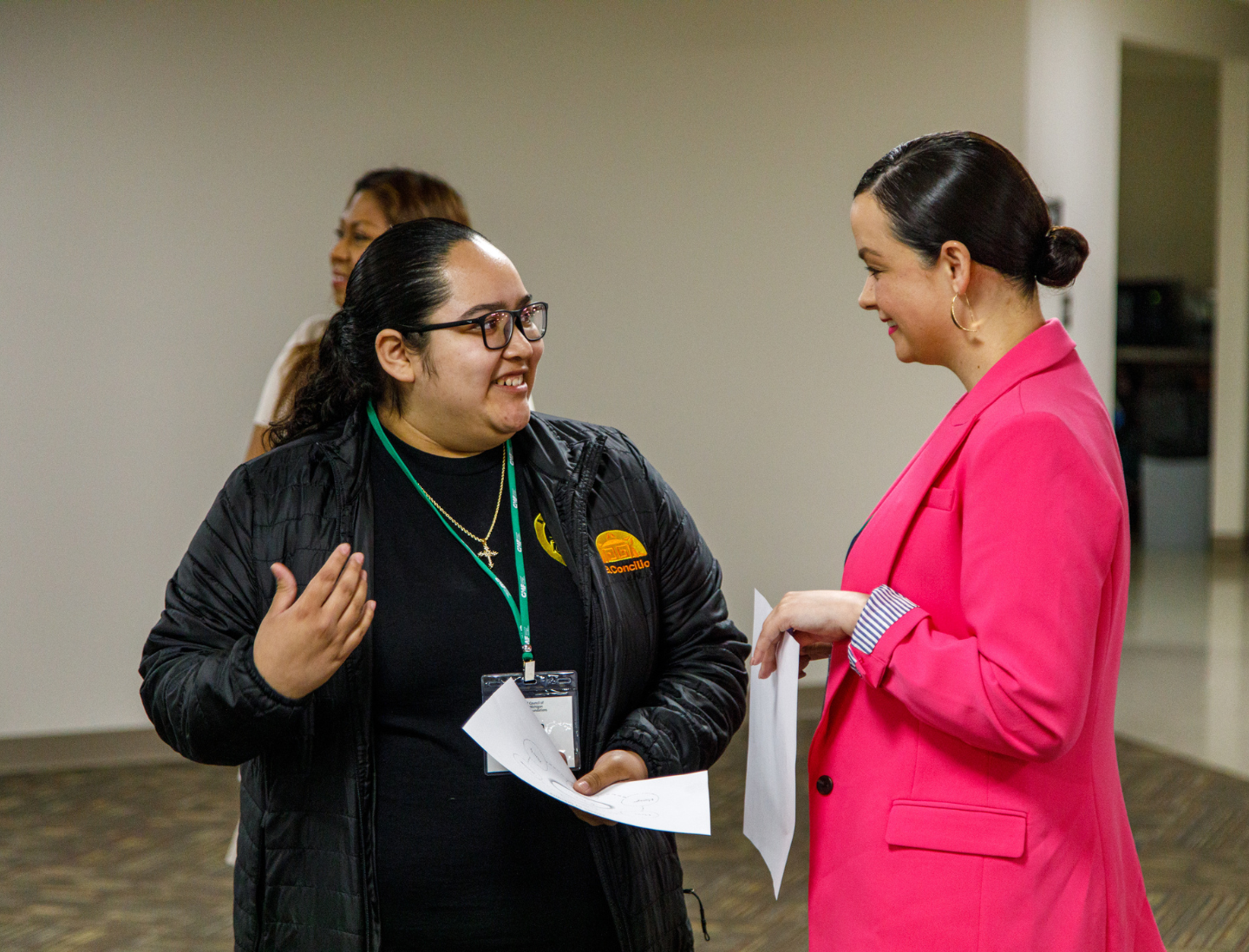 Two people engaged in conversation during a member event