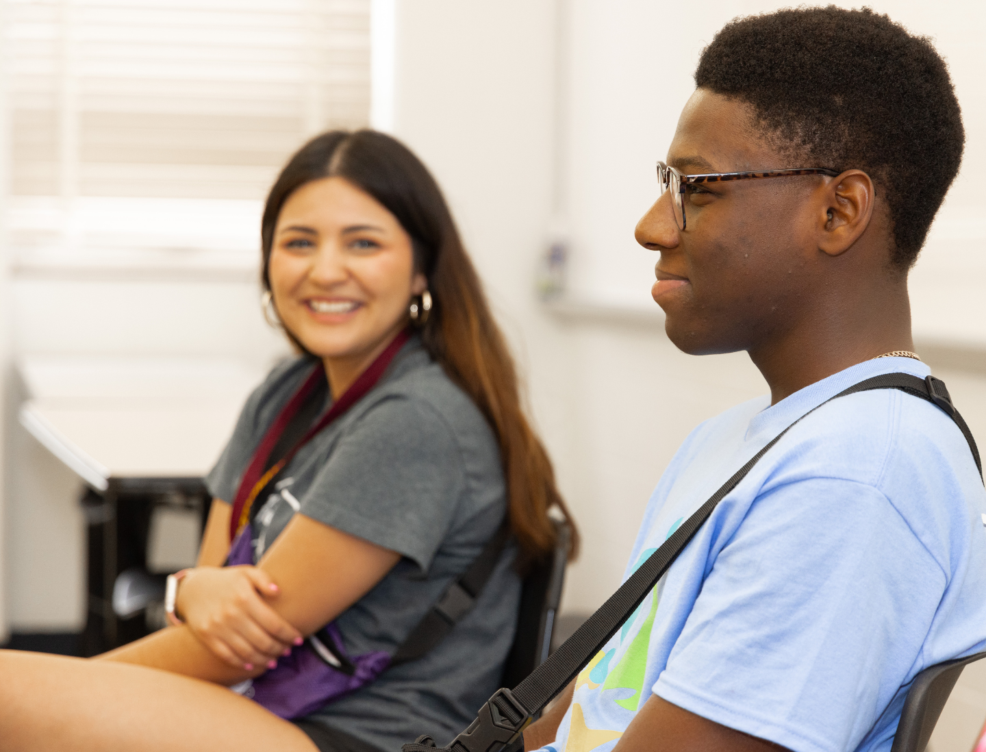 A participant during our youth programming shares during a program session while a peer looks on in admiration