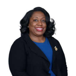 Headshot for Artisha Lawson, wearing a black jacket, blue shirt and smiling towards the camera